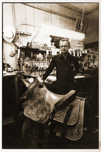 Bob Marrs at Bob Marrs Stockman's Saddle Shop with his hand-tooled poinsettia saddle. Photographed by Kurt Markus in 1981, Amarillo, Texas.