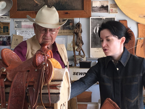 Saddle Maker Bob Marrs in his shop with Amy Sheets, his granddaughter and Marrs Makers Co-Founder