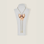 Marrs Makers Rose Gold Leather Bolo Necklace with Bow Ornament Braided Leather Cord Gold-Plated Metal Tips on Mannequin