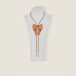 Marrs Makers Tan bow tie and lanyard set on a mannequin bust against a beige background