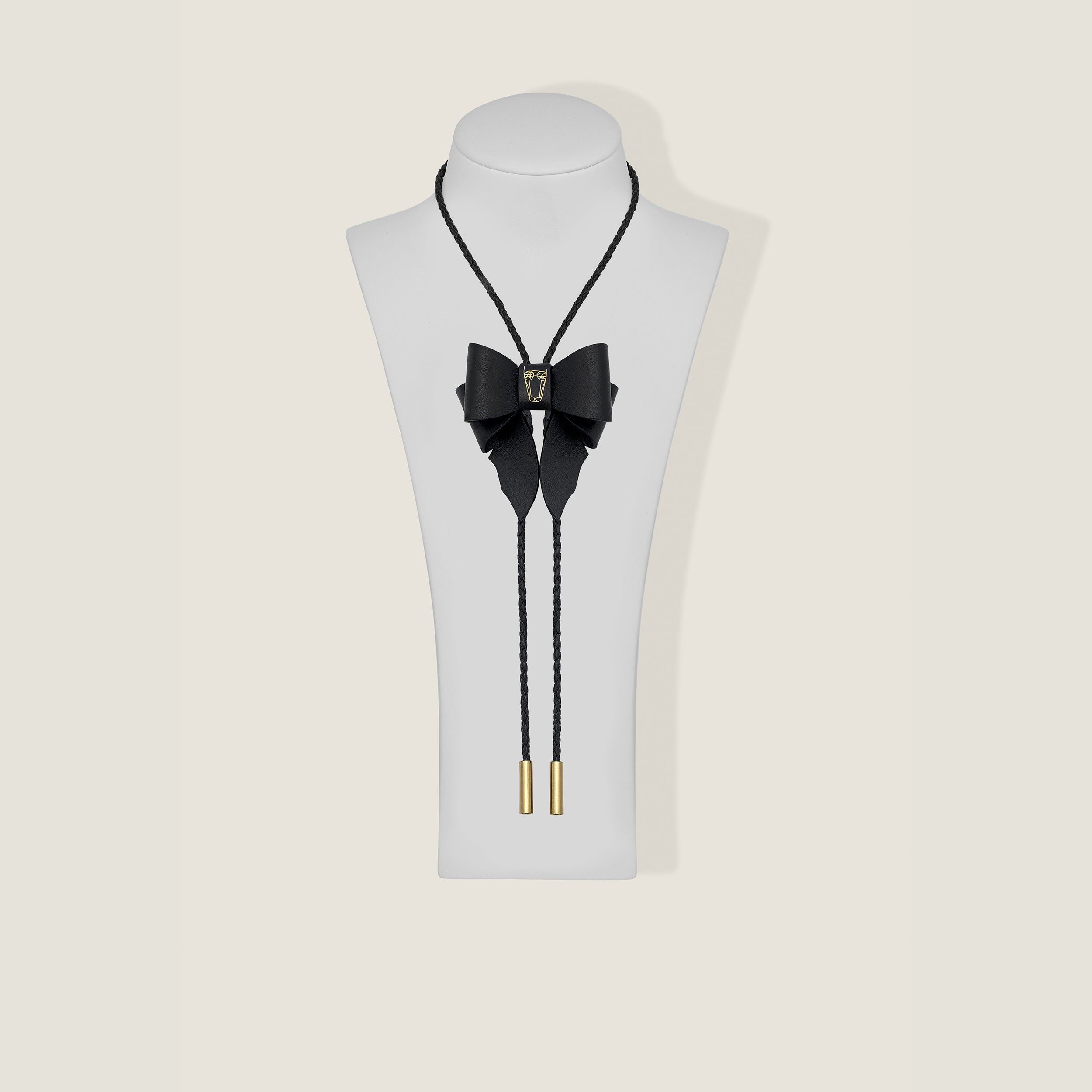 Marrs Makers Black Leather OG Bolo Necklace with Bow Ornament Braided Leather Cord Gold-Plated Metal Tips on Mannequin