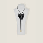 Marrs Makers Black Leather OG Bolo Necklace with Bow Ornament Braided Leather Cord Gold-Plated Metal Tips on Mannequin