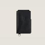 Black leather wallet with a brand logo on a beige background