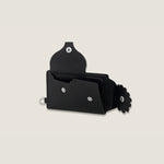 Black leather wallet with interior dividers for cards and flower accents on a beige background